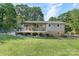 A sprawling backyard with a large wooden deck and lush green lawn perfect for outdoor entertaining at 1110 16Th Avenue Nw Pl, Hickory, NC 28601