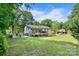 Expansive backyard featuring a large wooden deck, patio area, and well-maintained lawn at 1110 16Th Avenue Nw Pl, Hickory, NC 28601