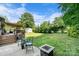 Lush backyard featuring a patio with furniture and a fire pit at 1110 16Th Avenue Nw Pl, Hickory, NC 28601