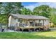 Spacious backyard with a wooden deck, outdoor grill, and a large lawn at 1110 16Th Avenue Nw Pl, Hickory, NC 28601