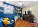 Bedroom featuring natural light, blue accent wall and wood floors at 1110 16Th Avenue Nw Pl, Hickory, NC 28601