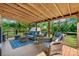 Outdoor deck with comfortable wicker seating, a rug, and string lights for evening relaxation at 1110 16Th Avenue Nw Pl, Hickory, NC 28601