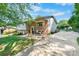Charming home featuring a blend of brick and siding, a welcoming porch, and a well-kept lawn at 1110 16Th Avenue Nw Pl, Hickory, NC 28601