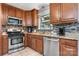 Traditional kitchen featuring granite countertops, stainless steel appliances and tile backsplash at 1110 16Th Avenue Nw Pl, Hickory, NC 28601