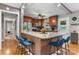 Open kitchen with granite counters, breakfast bar, stainless appliances and wood floors at 1110 16Th Avenue Nw Pl, Hickory, NC 28601