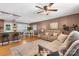 Open-concept living space with hardwood floors, cozy seating, and bar-style kitchen counter at 1110 16Th Avenue Nw Pl, Hickory, NC 28601