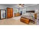 Spacious main bedroom with hardwood floors, two windows, large dresser, and a trunk at 1110 16Th Avenue Nw Pl, Hickory, NC 28601