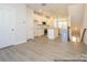 Modern kitchen view showcases white cabinets, marble counters, recessed lights and open floor plan at 1116 Bismuth Way, Charlotte, NC 28211