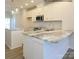 Bright kitchen with island, marble countertops, white cabinets, stainless appliances, and pendant lighting at 1116 Bismuth Way, Charlotte, NC 28211