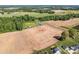 Aerial view capturing the expansive farmland surrounding the property at 1160 Redmon Rd, Cleveland, NC 27013