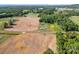 Expansive aerial view featuring the home, fields, and surrounding countryside at 1160 Redmon Rd, Cleveland, NC 27013