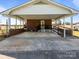 Spacious carport with ample parking and ramp access to the house at 1160 Redmon Rd, Cleveland, NC 27013