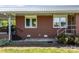 Exterior view showing the brick facade and well-maintained lawn at 1160 Redmon Rd, Cleveland, NC 27013