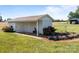 Exterior view of the detached garage featuring a landscaped garden at 1160 Redmon Rd, Cleveland, NC 27013