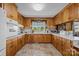 Bright kitchen featuring wood cabinets, white countertops, and tile flooring at 1160 Redmon Rd, Cleveland, NC 27013