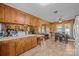 Kitchen featuring wood cabinets, tile floors, breakfast bar, and open view at 1160 Redmon Rd, Cleveland, NC 27013