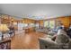 Spacious living room with hardwood floors, wood paneling, and plenty of natural light at 1160 Redmon Rd, Cleveland, NC 27013