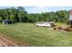 Large grassy yard with a detached garage at 1160 Redmon Rd, Cleveland, NC 27013