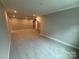 Large, finished basement features recessed lighting and neutral carpeting at 12032 Lavinia Ln, Charlotte, NC 28277