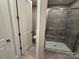 Modern bathroom features glass shower with bench, toilet, and stylish tile flooring at 12032 Lavinia Ln, Charlotte, NC 28277