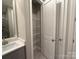 A bathroom features a modern vanity, closet, and contemporary fixtures at 12032 Lavinia Ln, Charlotte, NC 28277