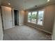 A bedroom with multiple windows to view the outdoors at 12032 Lavinia Ln, Charlotte, NC 28277