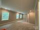 Spacious bedroom with carpet flooring, neutral walls and window view at 12032 Lavinia Ln, Charlotte, NC 28277