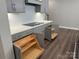 Gray cabinets with plenty of storage, cooktop, and white backsplash at 12032 Lavinia Ln, Charlotte, NC 28277