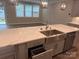 Beautiful island featuring marble countertops, a stainless steel sink, and a dishwasher at 12032 Lavinia Ln, Charlotte, NC 28277