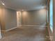 Living room featuring plush carpeting, neutral paint, and natural light at 12032 Lavinia Ln, Charlotte, NC 28277