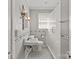 Bathroom featuring a glass-enclosed shower, a vintage sink, and tile floors at 1233 E Cannon Ave, Albemarle, NC 28001