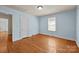 Charming bedroom featuring hardwood floors, fresh paint, and natural light at 1233 E Cannon Ave, Albemarle, NC 28001