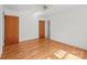 Bright bedroom featuring hardwood floors, neutral walls, and large closet at 1233 E Cannon Ave, Albemarle, NC 28001