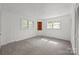 Cozy bedroom with triple windows, built-in corner shelving and neutral carpeting at 1233 E Cannon Ave, Albemarle, NC 28001