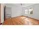 Bright bedroom with natural light and hardwood floors at 1233 E Cannon Ave, Albemarle, NC 28001
