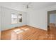 Bright bedroom featuring hardwood floors, neutral walls, and natural light at 1233 E Cannon Ave, Albemarle, NC 28001