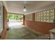 Spacious covered carport with brick walls and access to the house at 1233 E Cannon Ave, Albemarle, NC 28001
