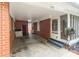 Covered carport with brick walls and overhead lighting at 1233 E Cannon Ave, Albemarle, NC 28001