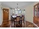 Cozy dining area featuring a wood table, hutch, and bright natural light at 1233 E Cannon Ave, Albemarle, NC 28001