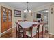 Dining room with hardwood floors, hutch, and view to the living room at 1233 E Cannon Ave, Albemarle, NC 28001