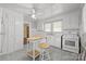 Bright kitchen with white cabinetry, a center island, linoleum floors, and modern appliances at 1233 E Cannon Ave, Albemarle, NC 28001