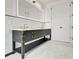 Elegant bathroom featuring a double vanity with marble countertops and modern fixtures at 124 Clipper Ln, Mooresville, NC 28117
