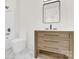Bathroom featuring a modern vanity, toilet, and bathtub at 124 Clipper Ln, Mooresville, NC 28117
