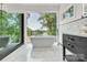 Luxurious bathroom with a soaking tub, marble floors, and a beautiful view at 124 Clipper Ln, Mooresville, NC 28117
