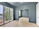 Bedroom with gray walls, hardwood floors, walkout balcony, and great natural light at 124 Clipper Ln, Mooresville, NC 28117