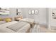 Bright bedroom featuring two twin beds, stylish art, and neutral decor at 124 Clipper Ln, Mooresville, NC 28117