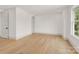 Bright and airy bedroom featuring hardwood floors and natural light from the window at 124 Clipper Ln, Mooresville, NC 28117
