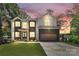 Beautiful modern home with a two-car garage and well-manicured lawn and professional landscaping at 124 Clipper Ln, Mooresville, NC 28117