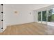 Bright living room with light hardwood floors, recessed lighting and access to an outdoor deck at 124 Clipper Ln, Mooresville, NC 28117