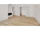 Open living area featuring an electric fireplace and recessed lighting, with access to outdoor space at 124 Clipper Ln, Mooresville, NC 28117